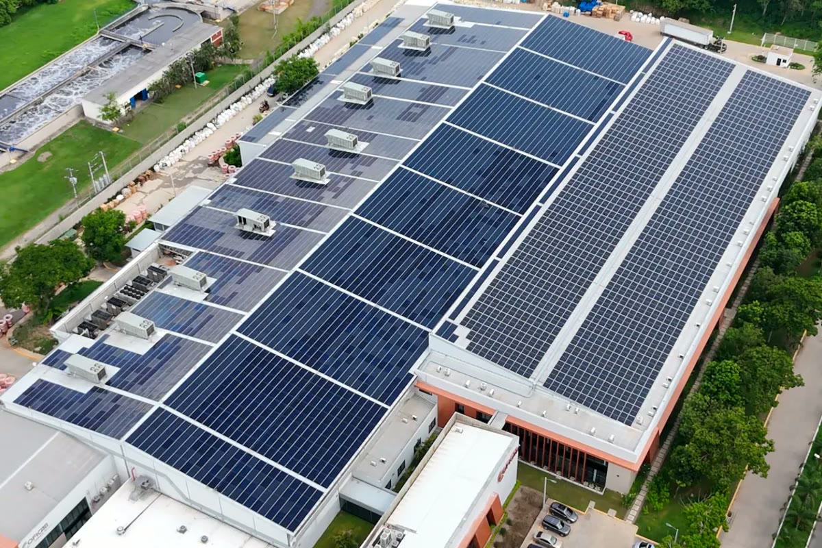 Aerial view of a COFICAB plant with solar panels on the roof